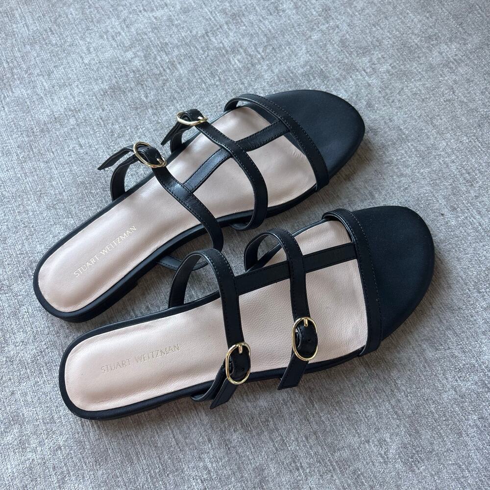 $300 Stuart Weitzman Grecian Buckle flat slide sandals in black leather